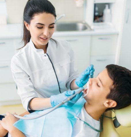Child getting preventive dental care from a friendly dentist in All Smile BDS Blacktown.